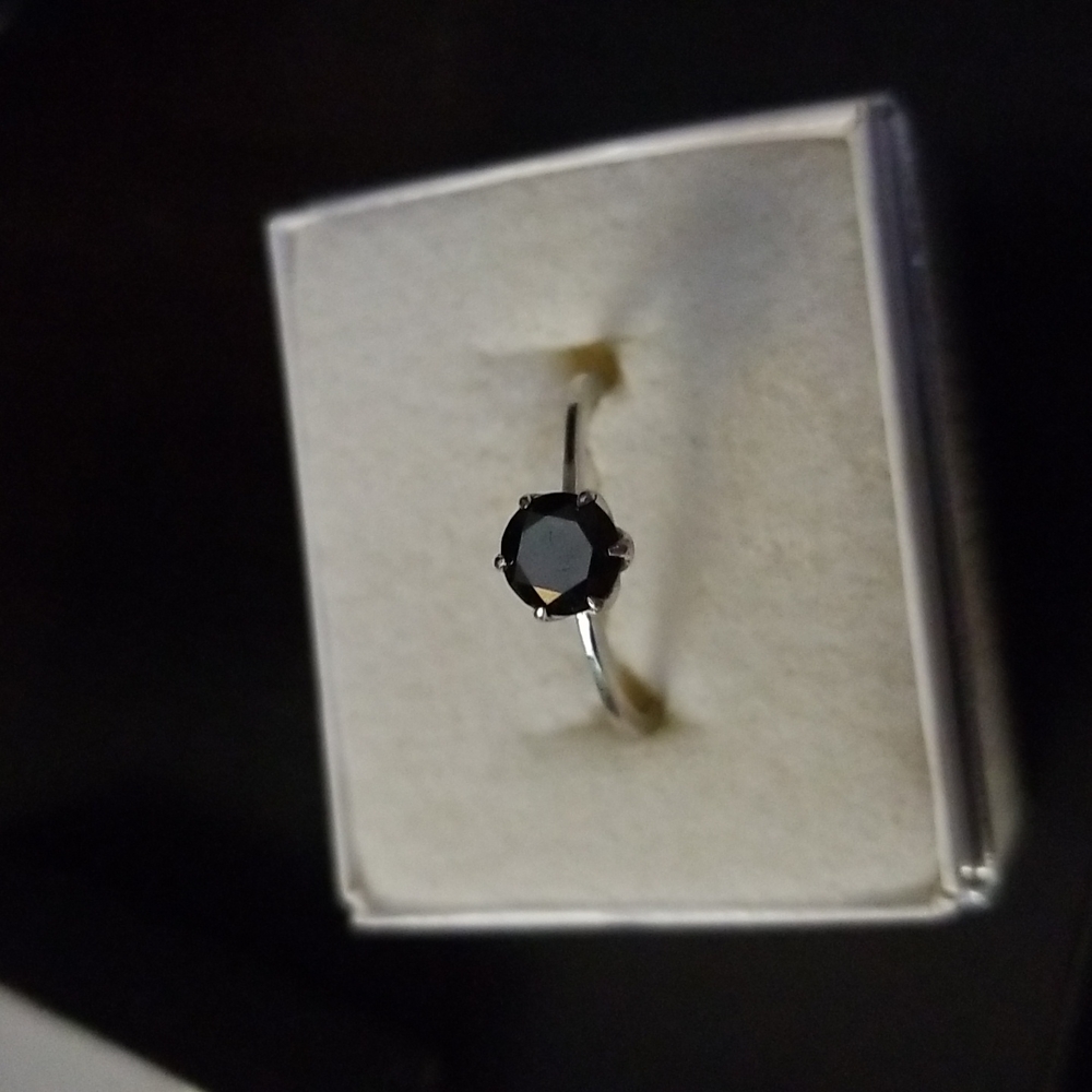 Black diamond solitaire approx .75 diamond weight